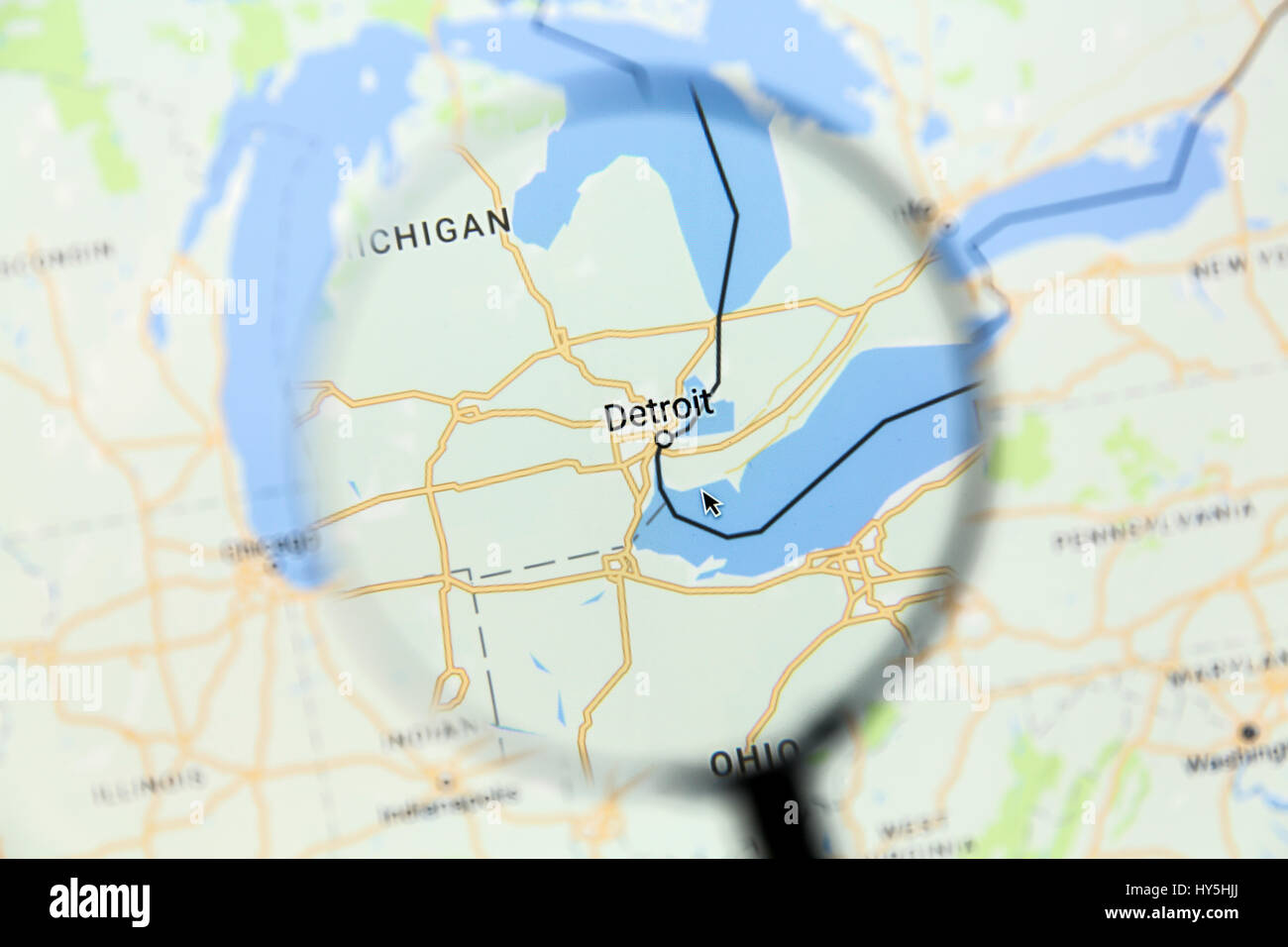 Map of Detroit on Google Maps under a magnifying glass. Detroit is the most populous city in the U.S. state of Michigan, Stock Photo