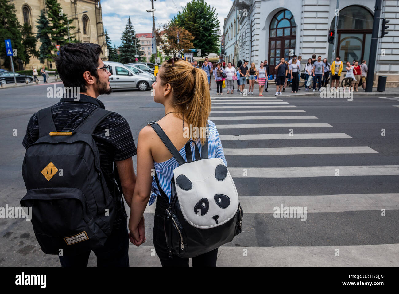 Couple on a pedestrian crossing in Cluj Napoca, second most populous city in Romania Stock Photo