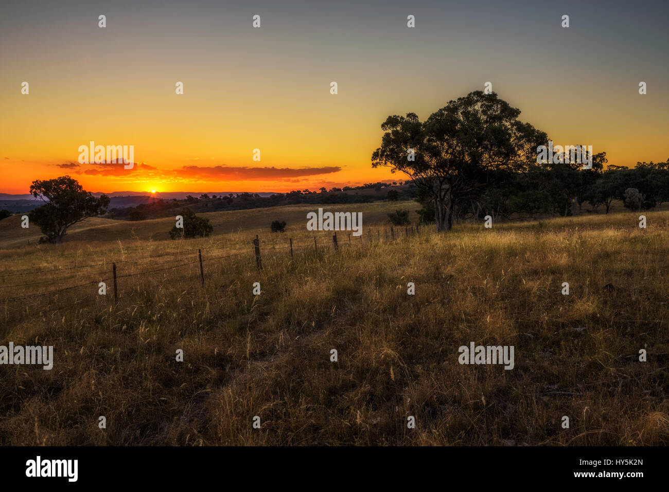 Scenic countryside landscape at sunset in Australia Stock Photo
