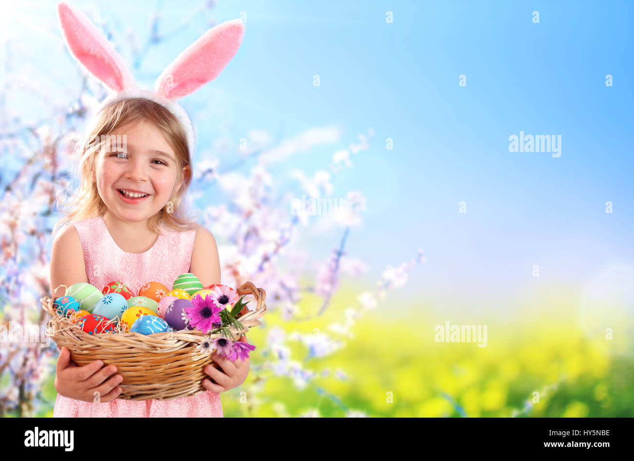 Easter - Little Girl With Basket Eggs And Bunny Ears Stock Photo