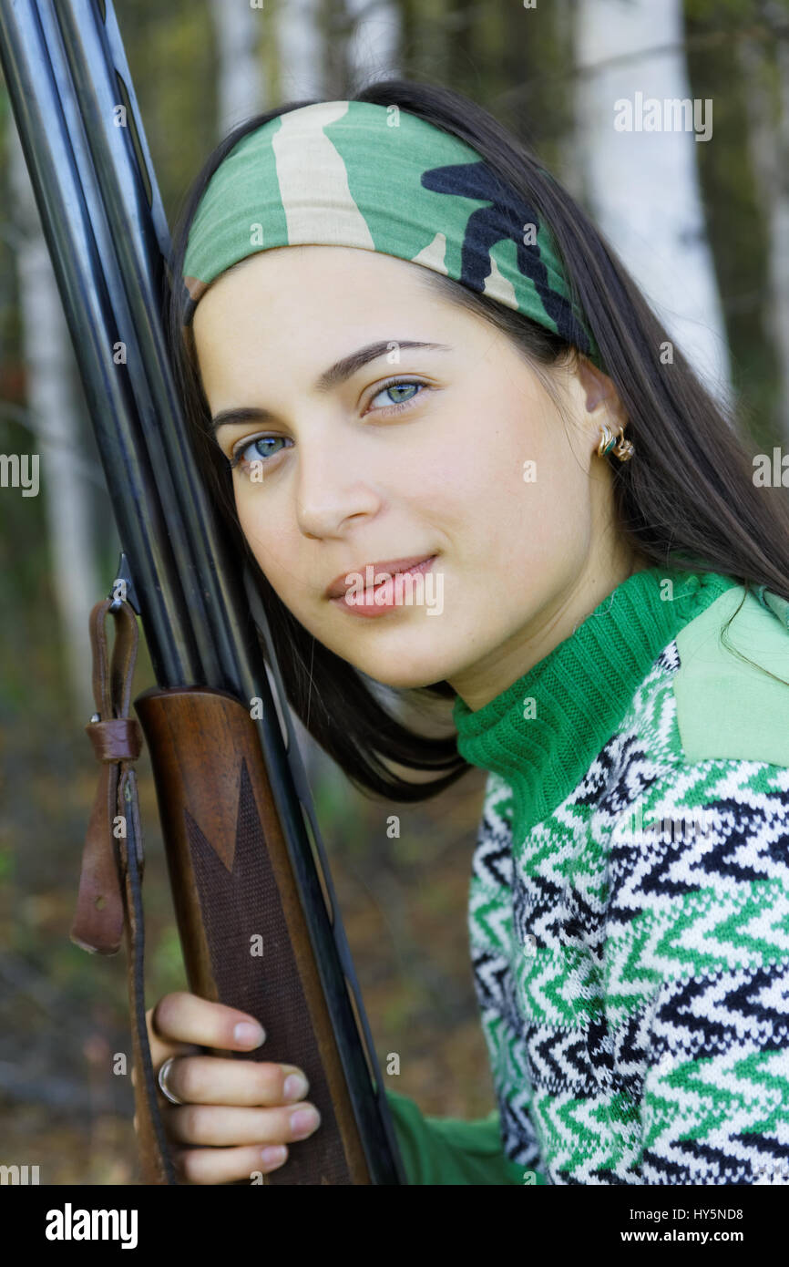 Portrait of a girl with a gun Stock Photo