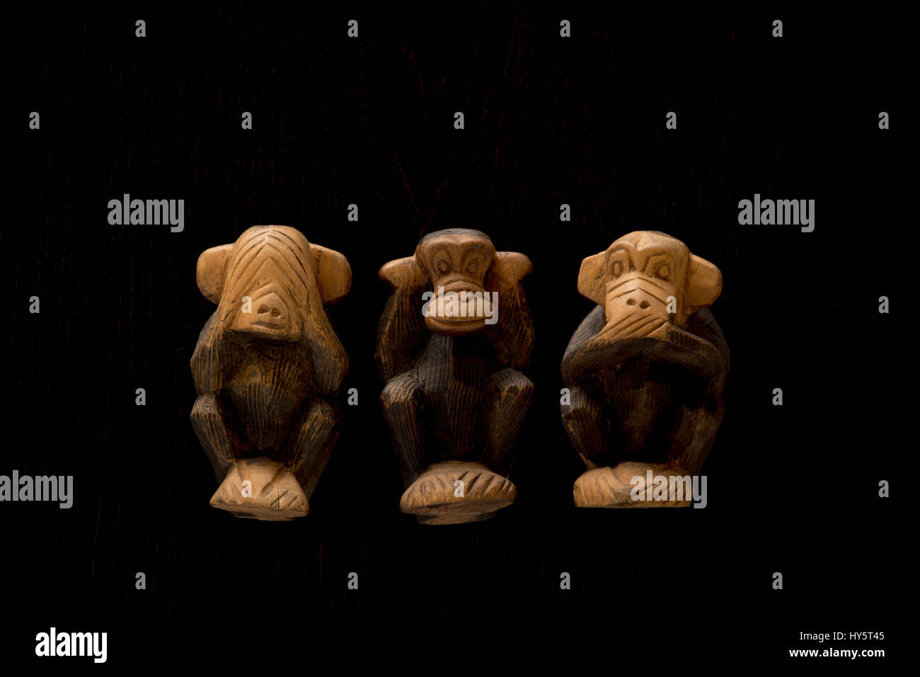 ape,character,concept,evil,hear,icon,Japan,japanese,mute,see,speak,statues,story,symbol,three,three wise monkeys,wisdom,wooden statue,black background,cut-out,object,objects,stilllife,studio Stock Photo