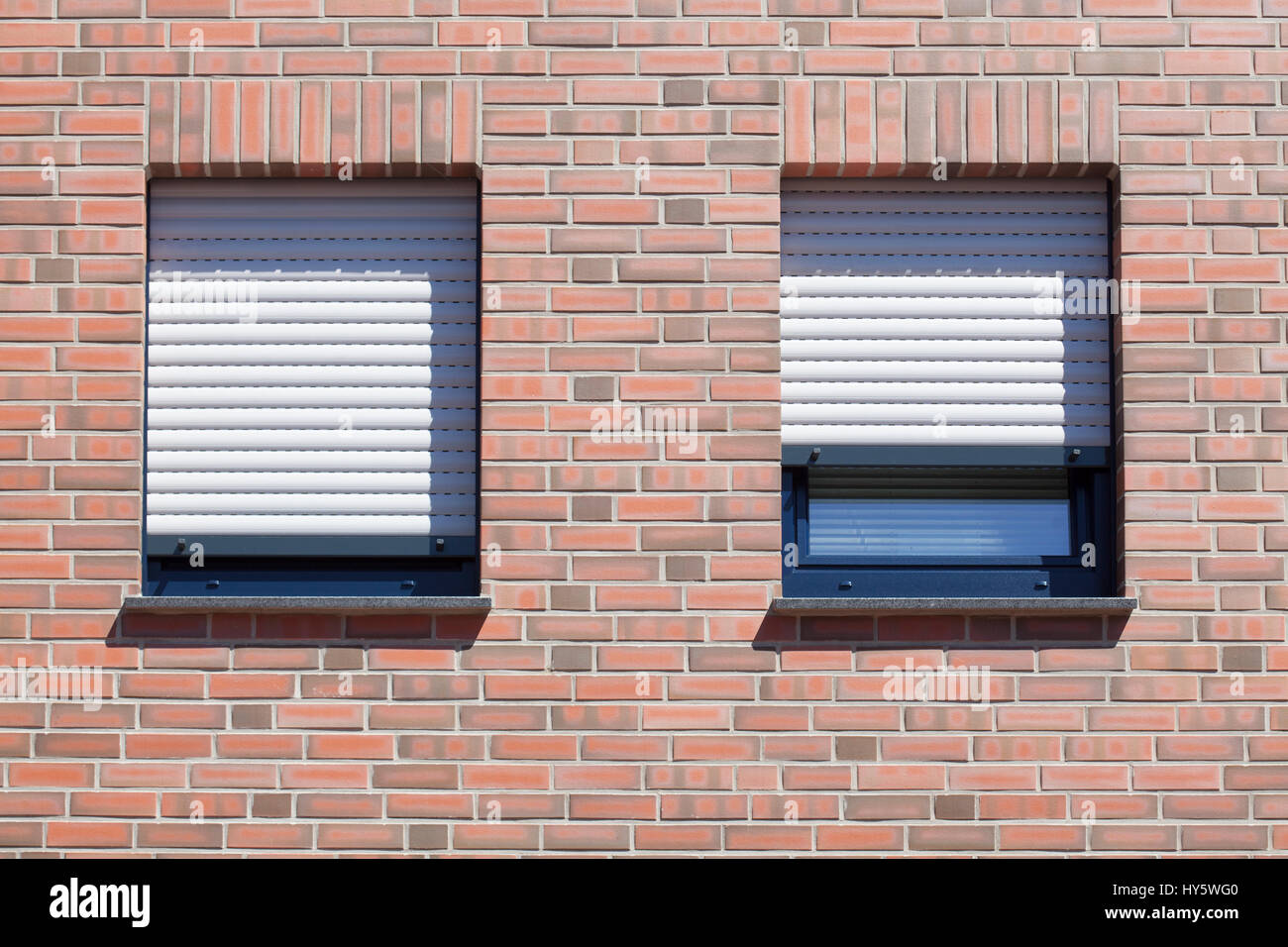 Windows with closed shutters on a red House Wall Stock Photo - Alamy