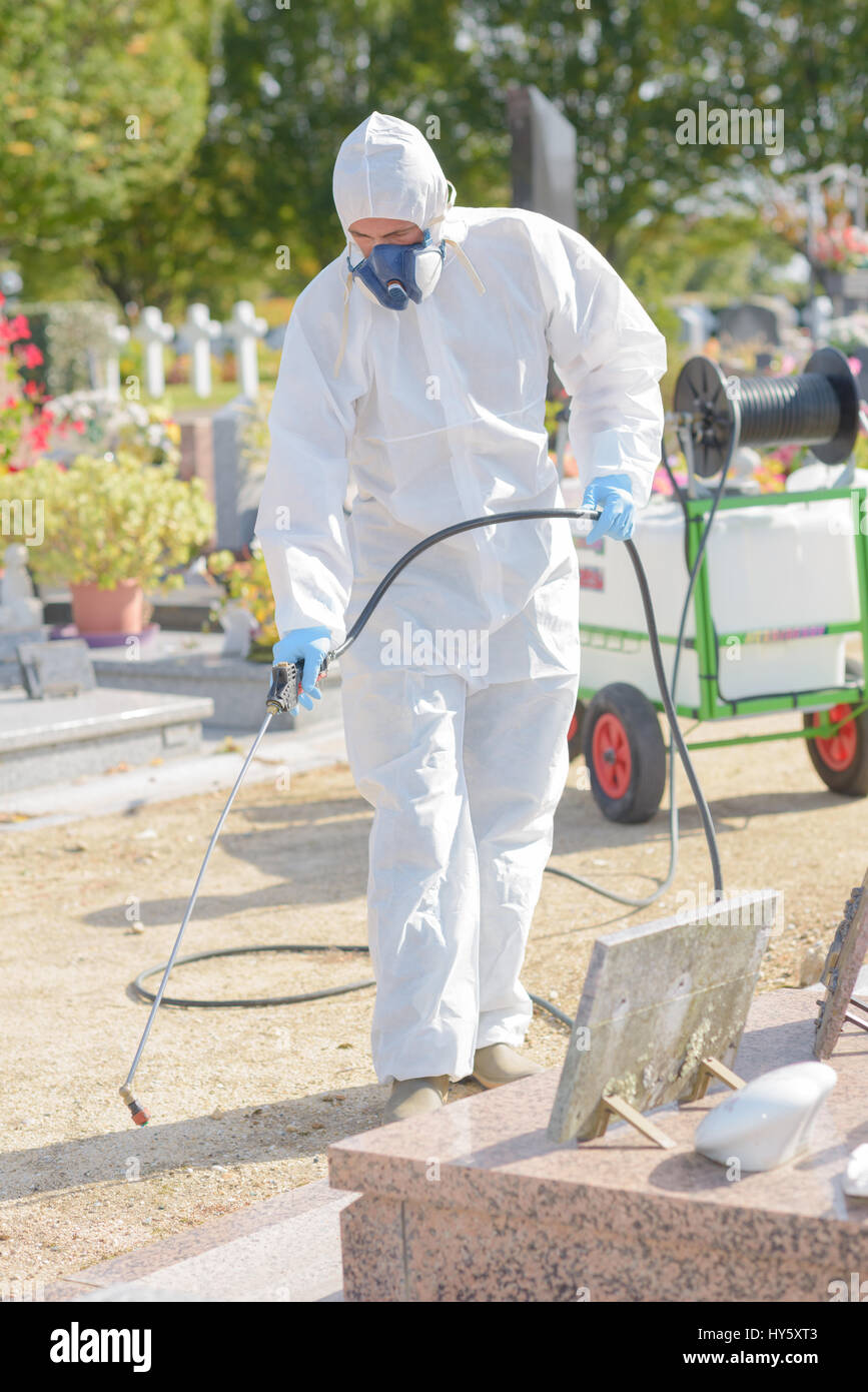 Man spraying chemical weed killer in cemetery Stock Photo Alamy