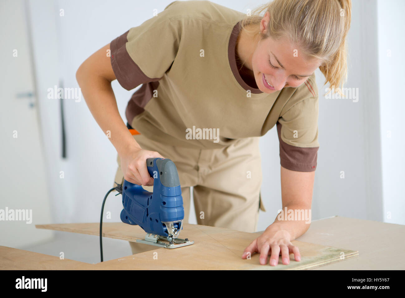 cutting a plywood Stock Photo