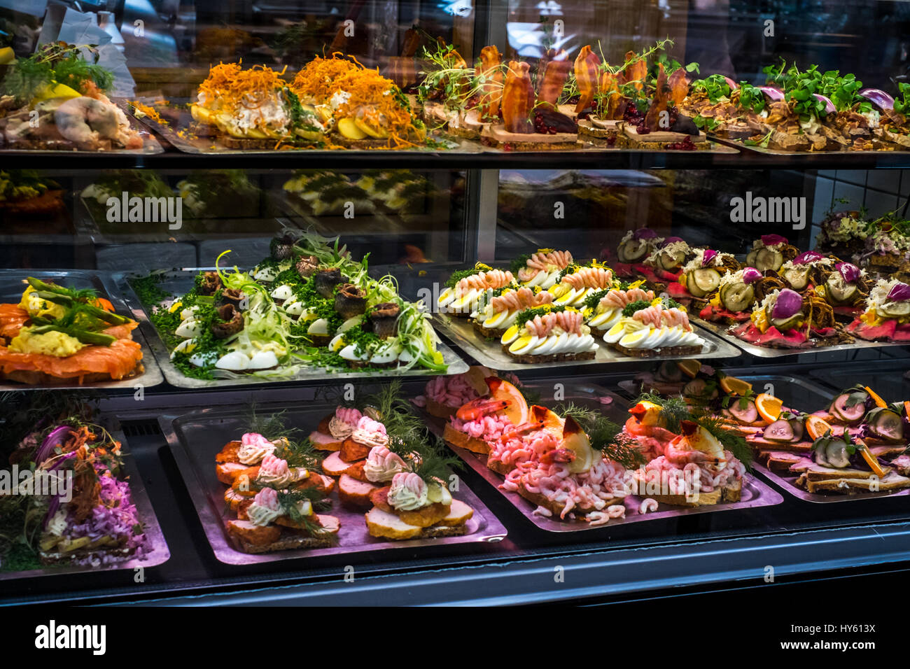 Mouth-watering display of Danish Smørrebrød, traditional open rye bread sandwiches, in Torvehallerne, Copenhagen, Denmark Stock Photo