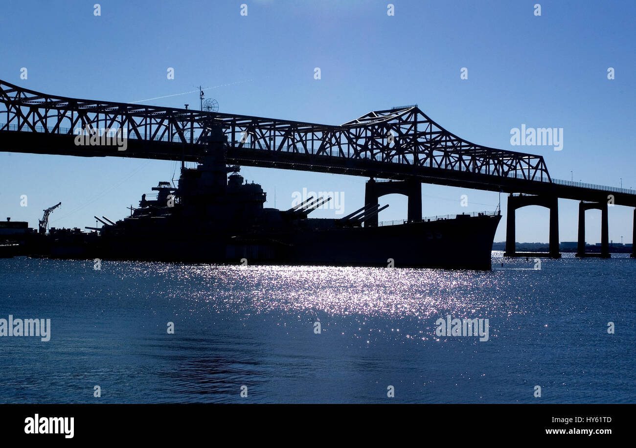 Heritage Park and the Battleship Massachusetts with the Braga Bridge in the background.  Fall River, Massachusetts Stock Photo