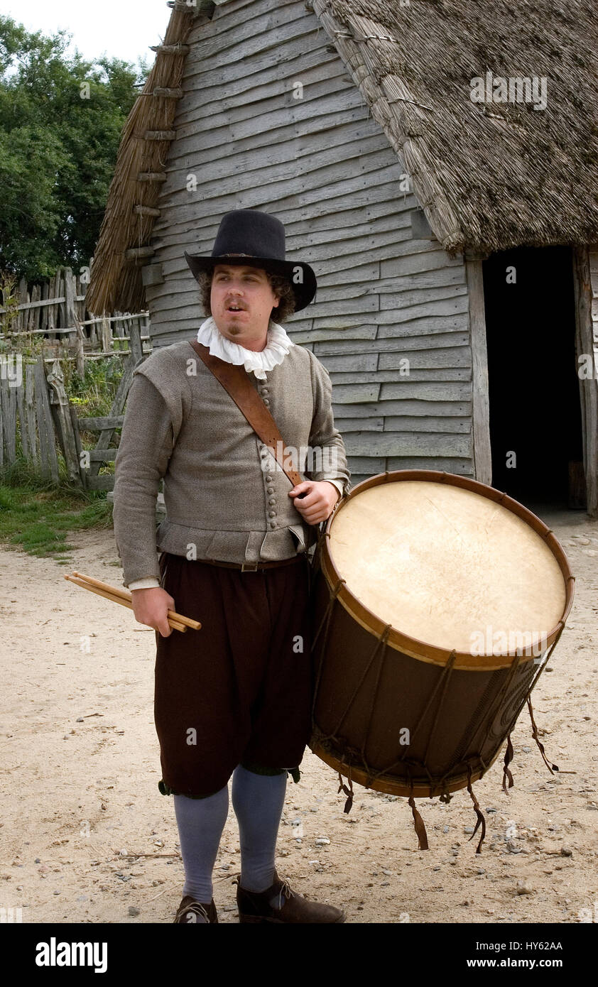 A Pilgrim outside his home in Plimoth Plantation -- (released through Plimoth Plantation), Plymouth, Massachusetts. Now known as Plimoth Pataxet Stock Photo