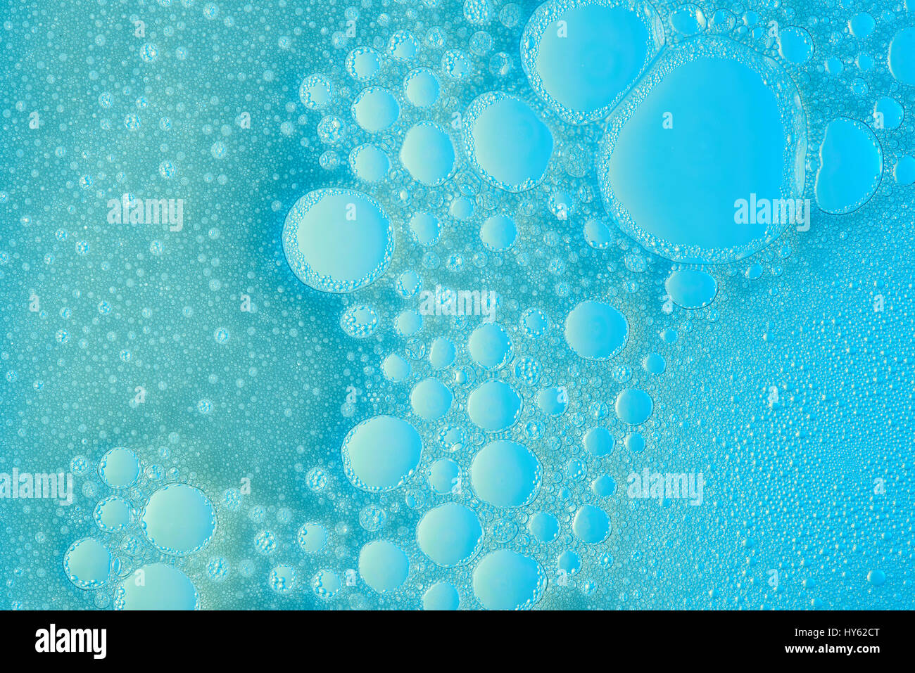 Abstract blue bubbles surface. Closeup of soap liquid texture Stock Photo