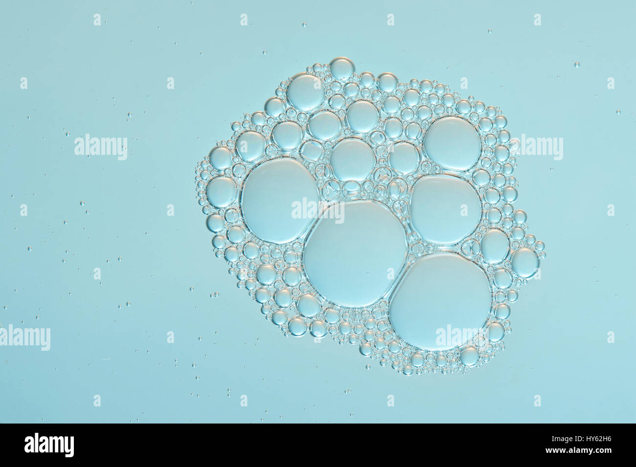 Bubble foam close up on clear water calm surface background Stock Photo