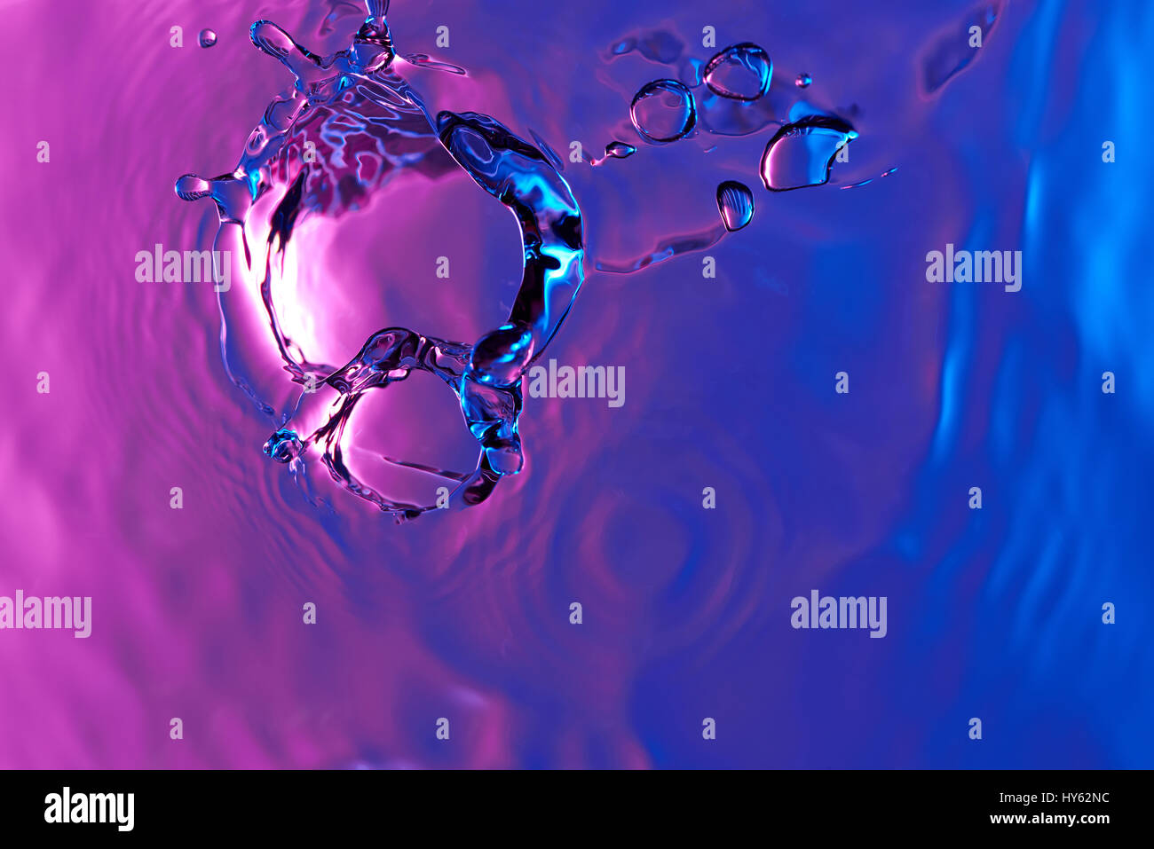 Colorful water splash view from top. Abstract blue and pink liquid lines Stock Photo