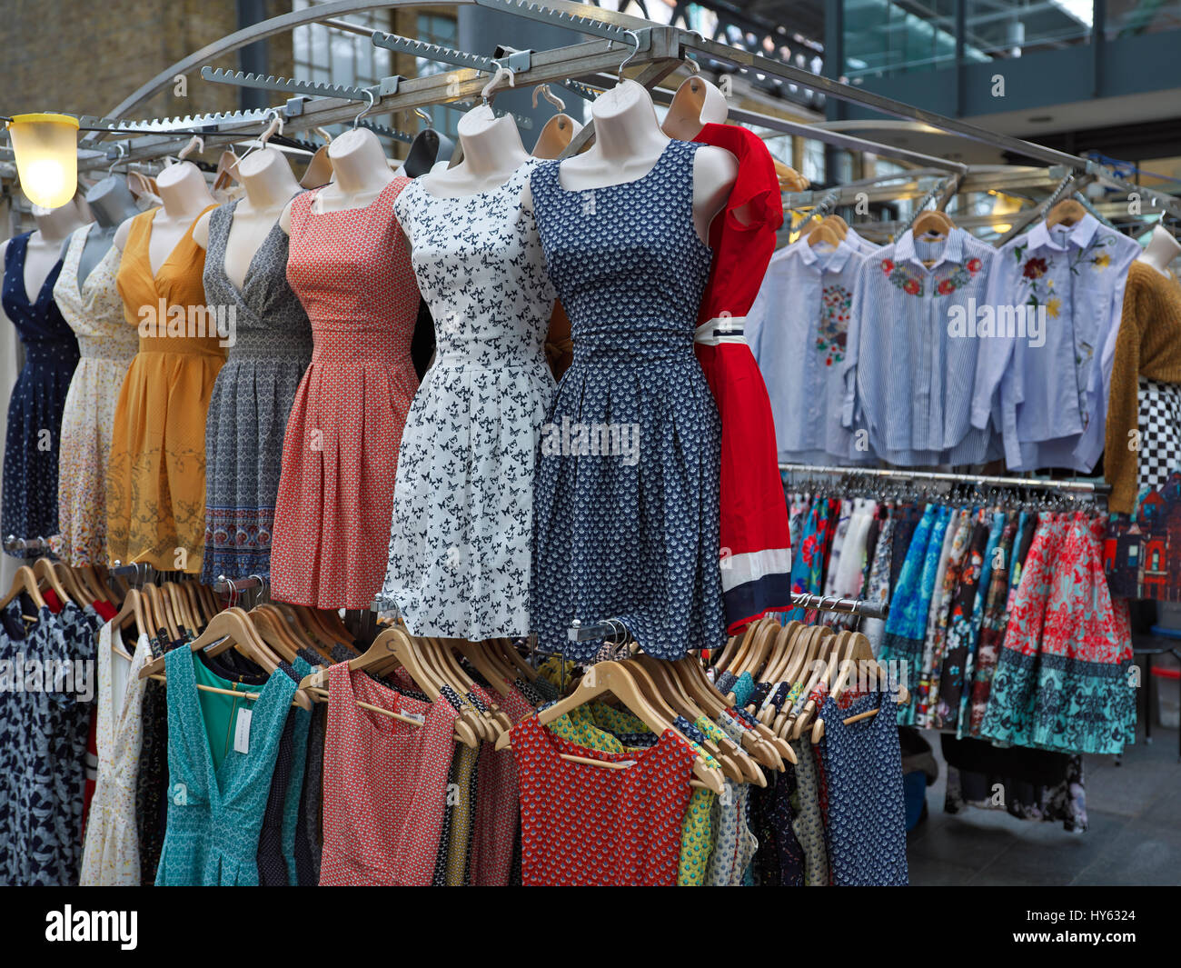 Dresses hanging for sale in Spitalfields market Stock Photo