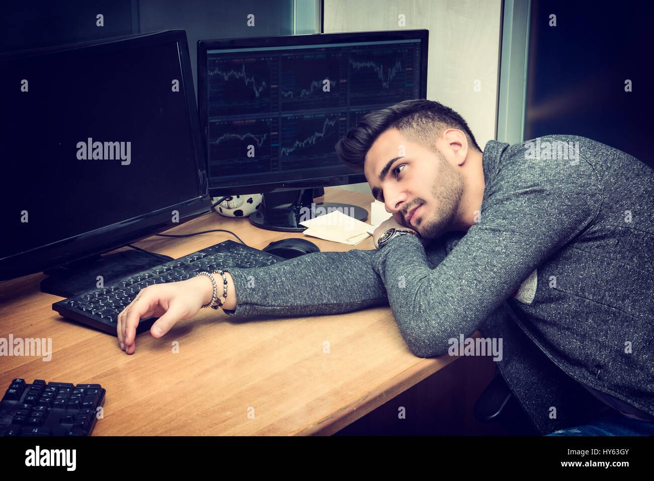 Tired bored sleepy young businessman Stock Photo