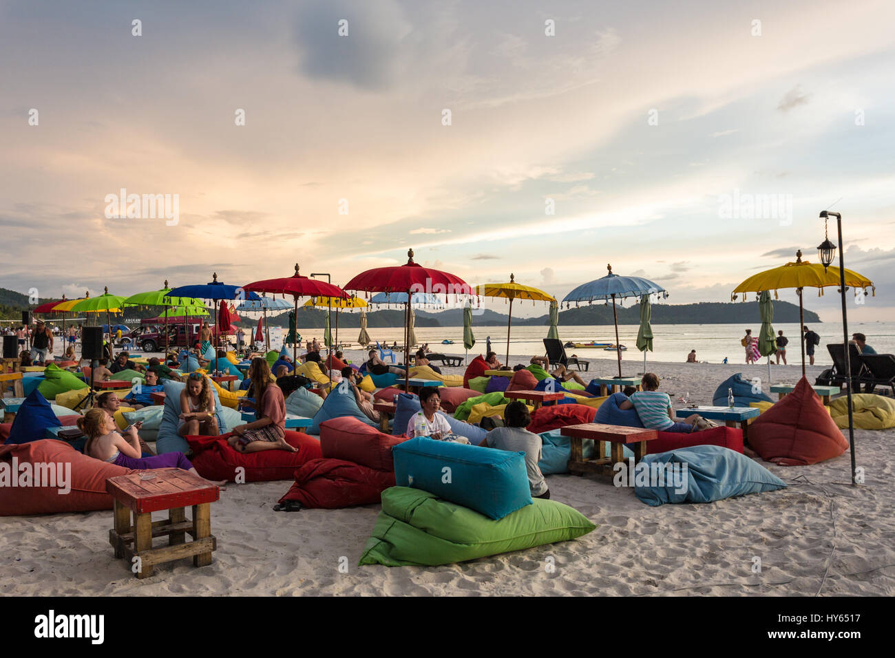 LANGKAWI, MALAYSIA - JANUARY 19, 2017: Tourists enjoy a drink in a beach bar on Cenang beach in Langkawi, an island in the Andaman sea in Malaysia Stock Photo