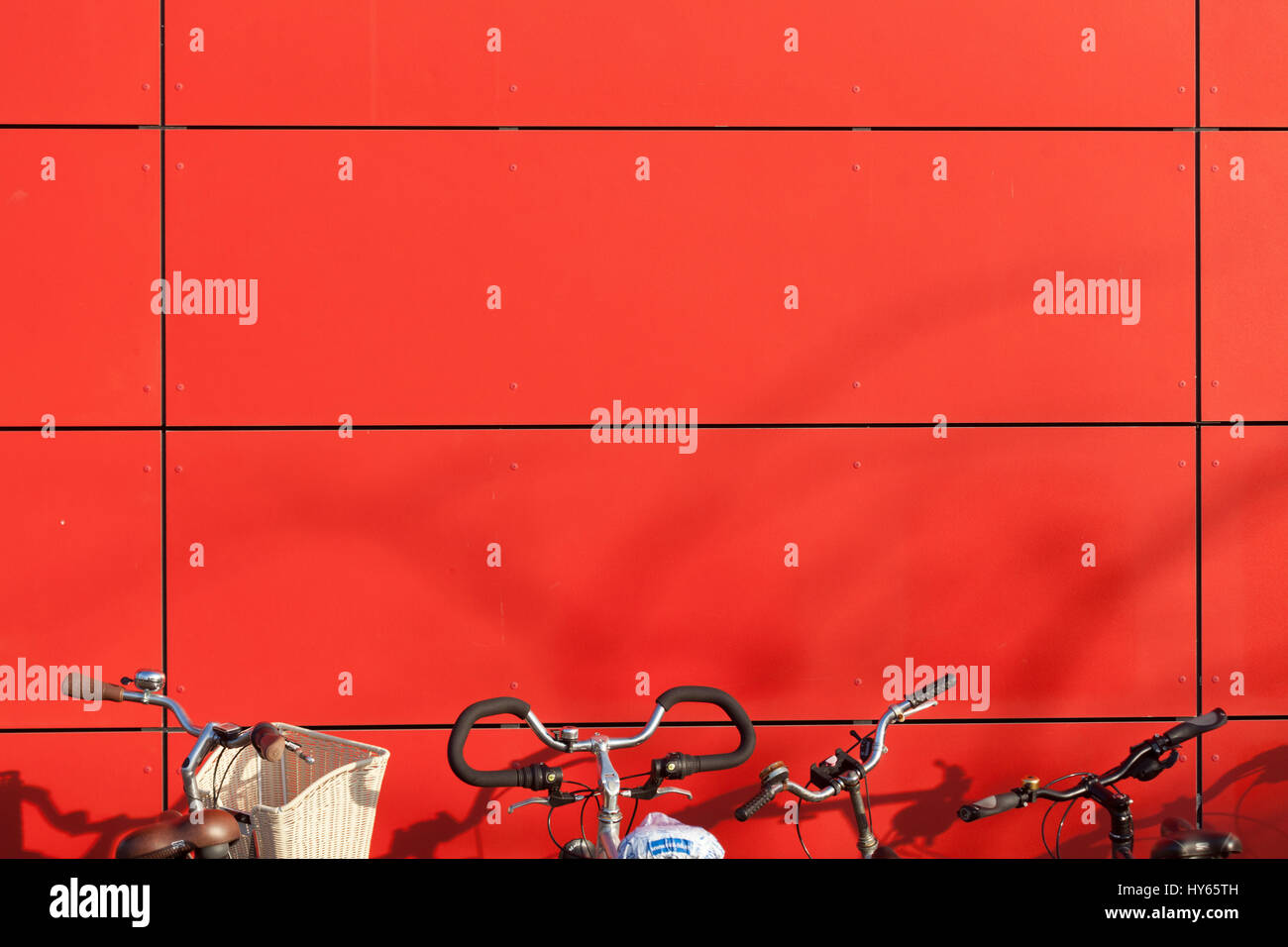 Red House Wall, Parking  Bicycles, Germany, Europe Stock Photo