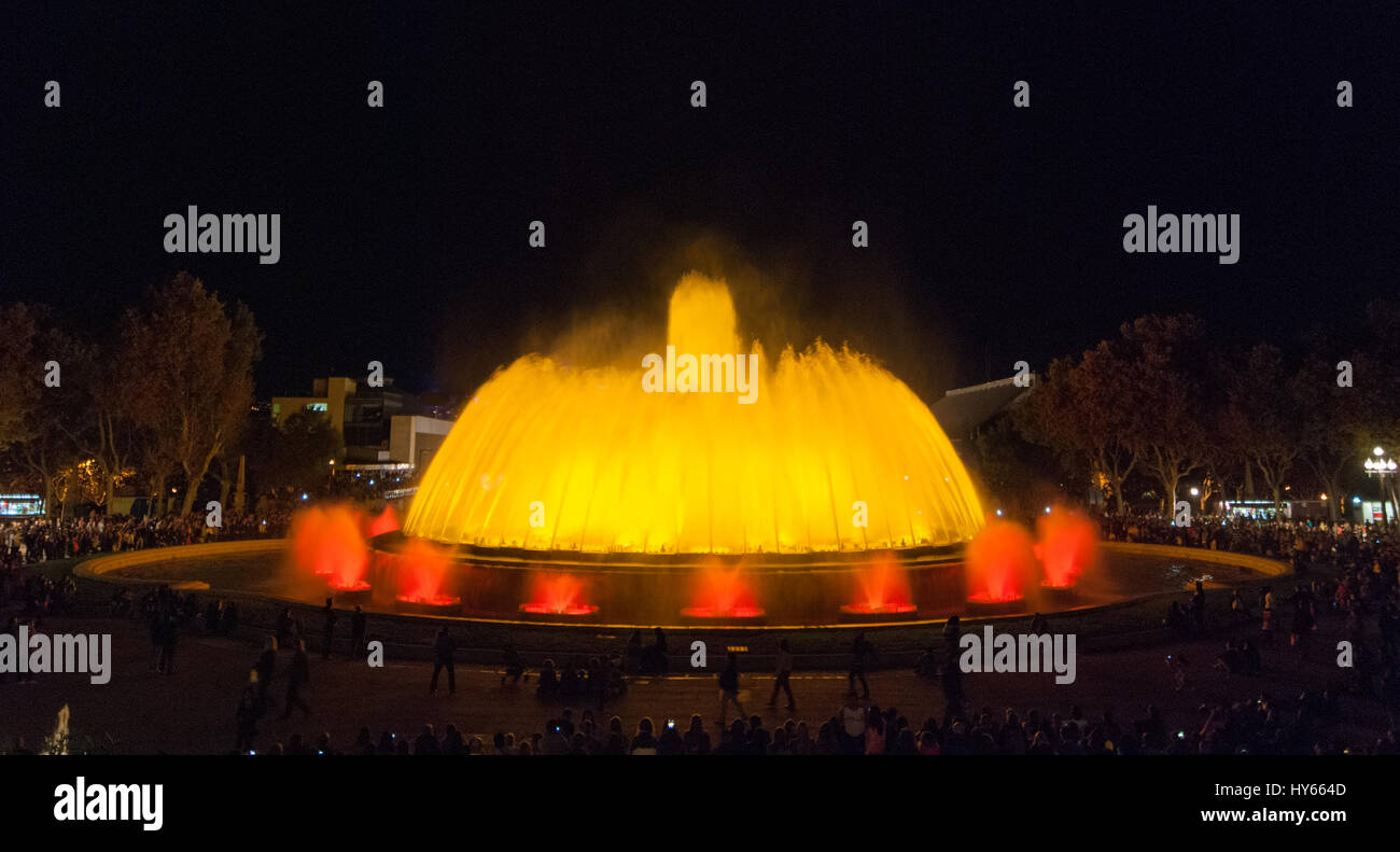 People attend colourful light & water fountain show. Night at the Magic ...