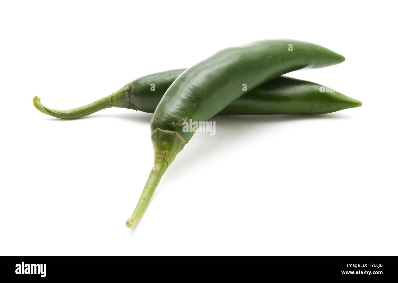 Red and green hot chili peppers isolated on white background closeup ...