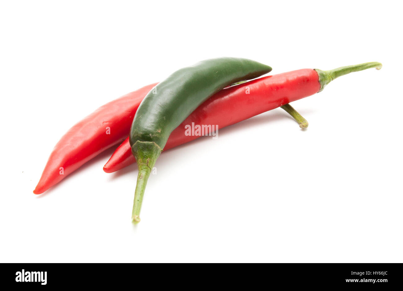 Red and green hot chili peppers isolated on white background closeup ...