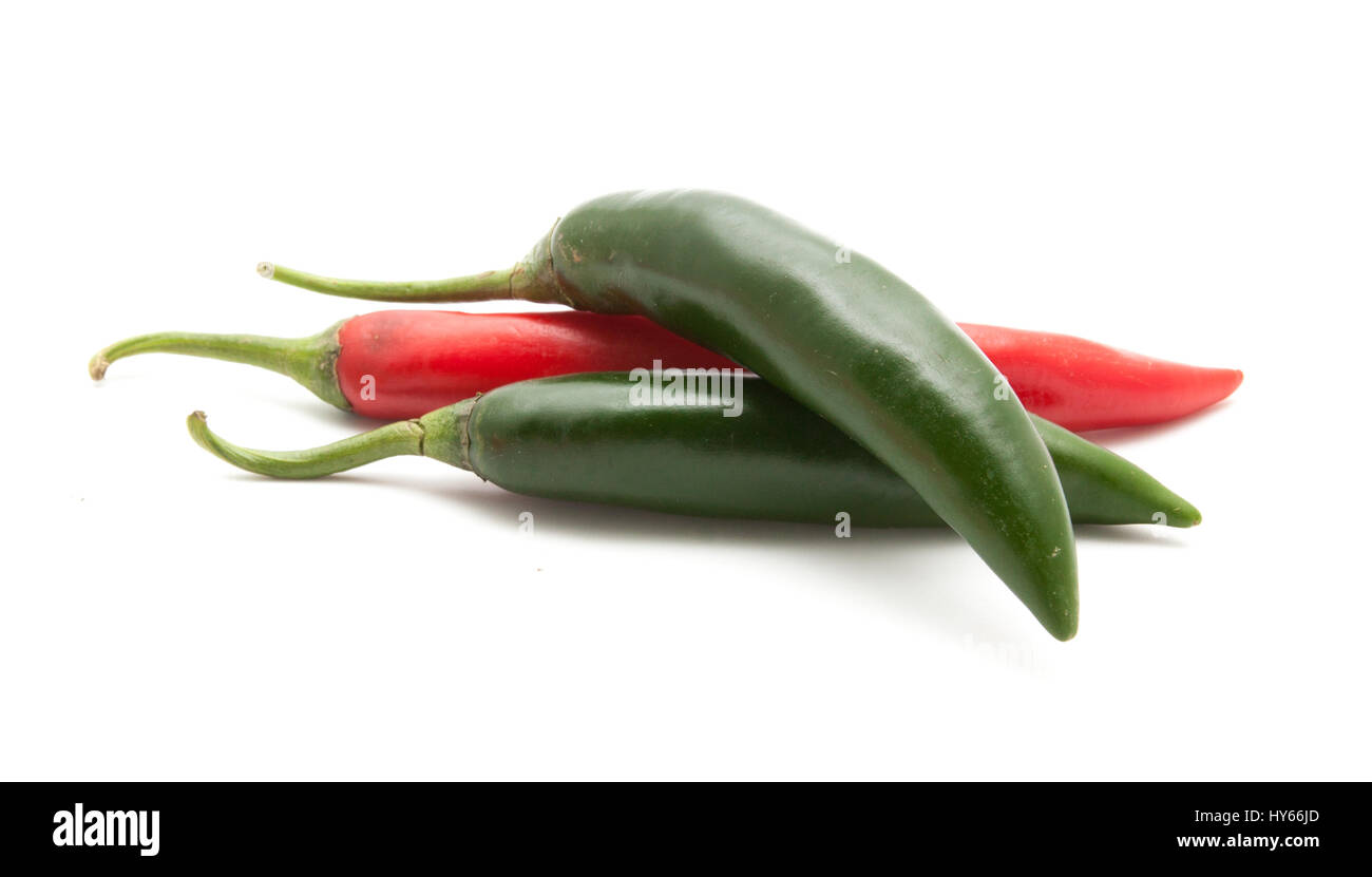 Red and green hot chili peppers isolated on white background closeup ...