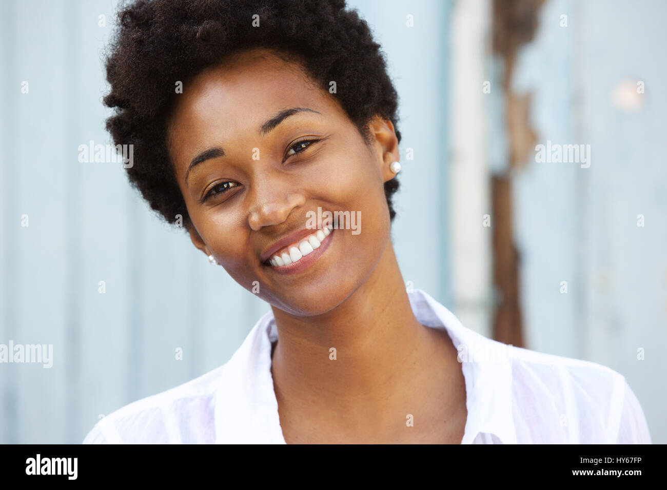 Close up portrait of a happy young african woman with beautiful smile ...