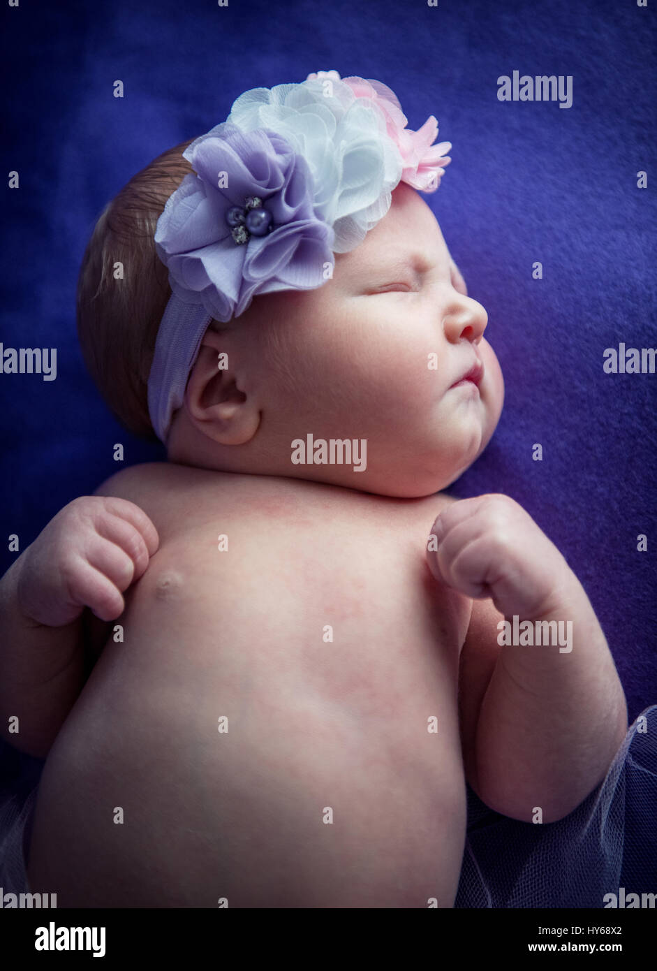 Beautiful newborn baby girl sleeping on a blanket Stock Photo