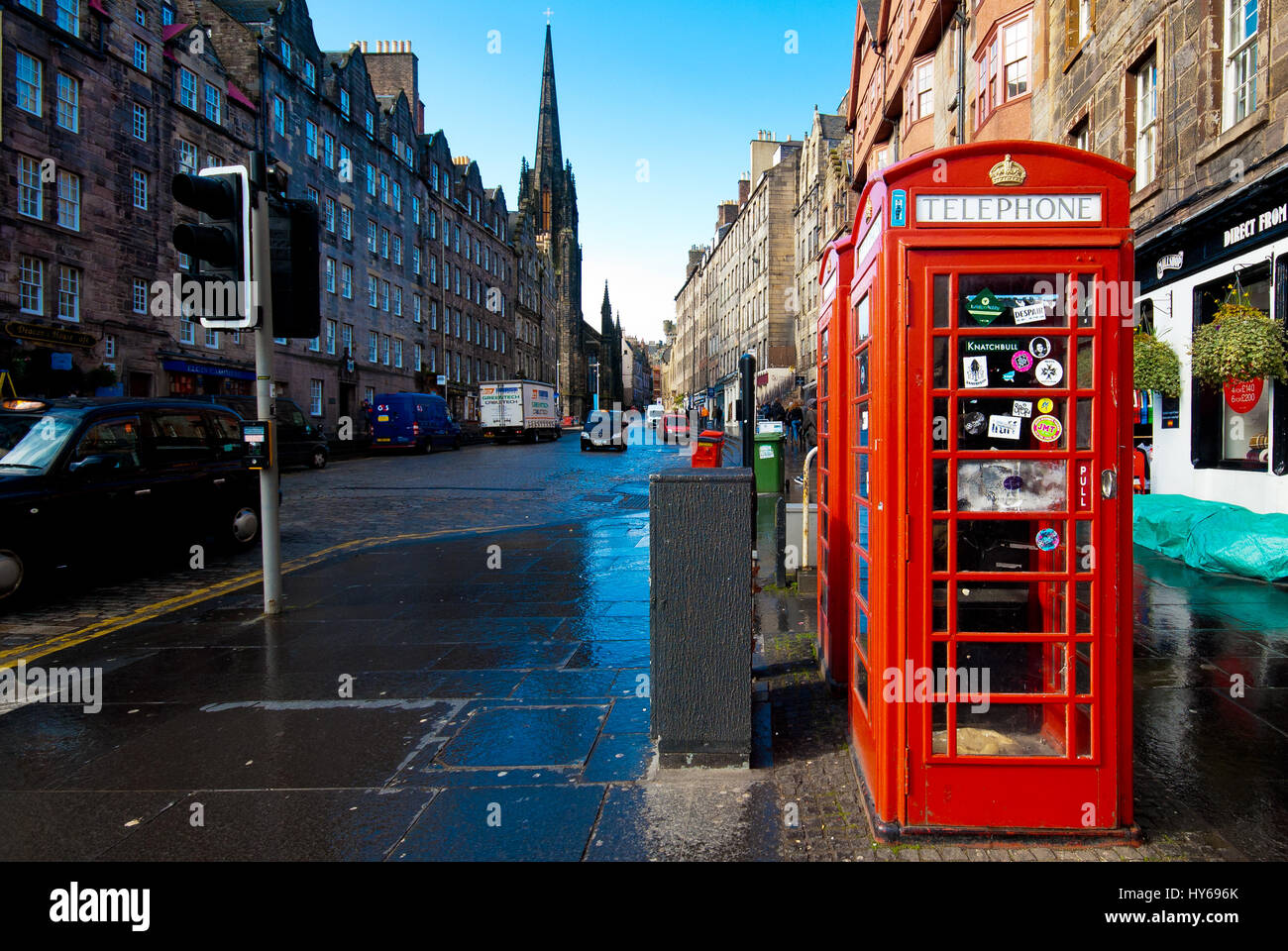 View of Edinburgh (Scotland) street and the red telephone booth in front. Stock Photo