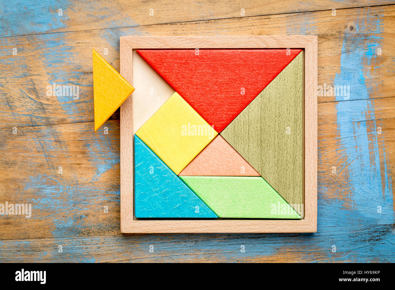 Tangram, a traditional Chinese Puzzle Game made of different wood parts to  build abstract figures from them Stock Photo - Alamy