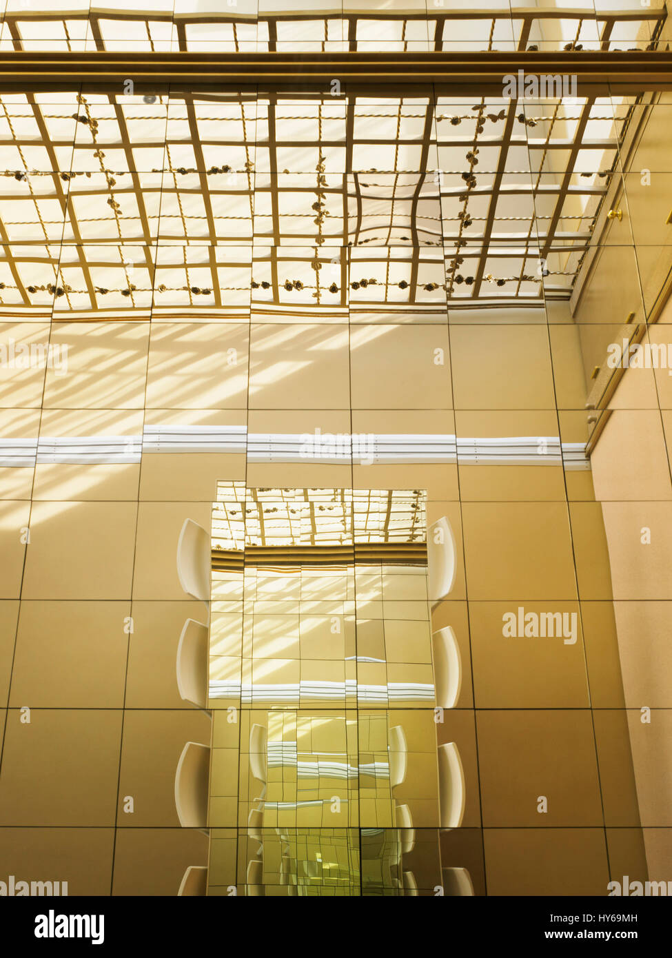 Looking onto the mirrored dining table from above and seeing its