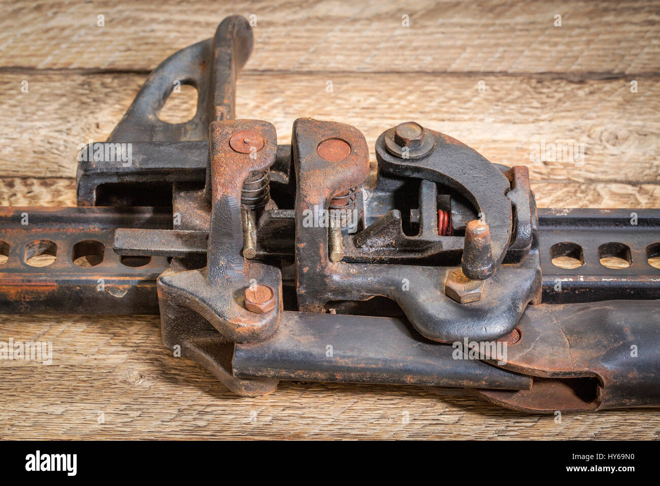 metal gear abstract a detail of high lift jack mechanism on rustic