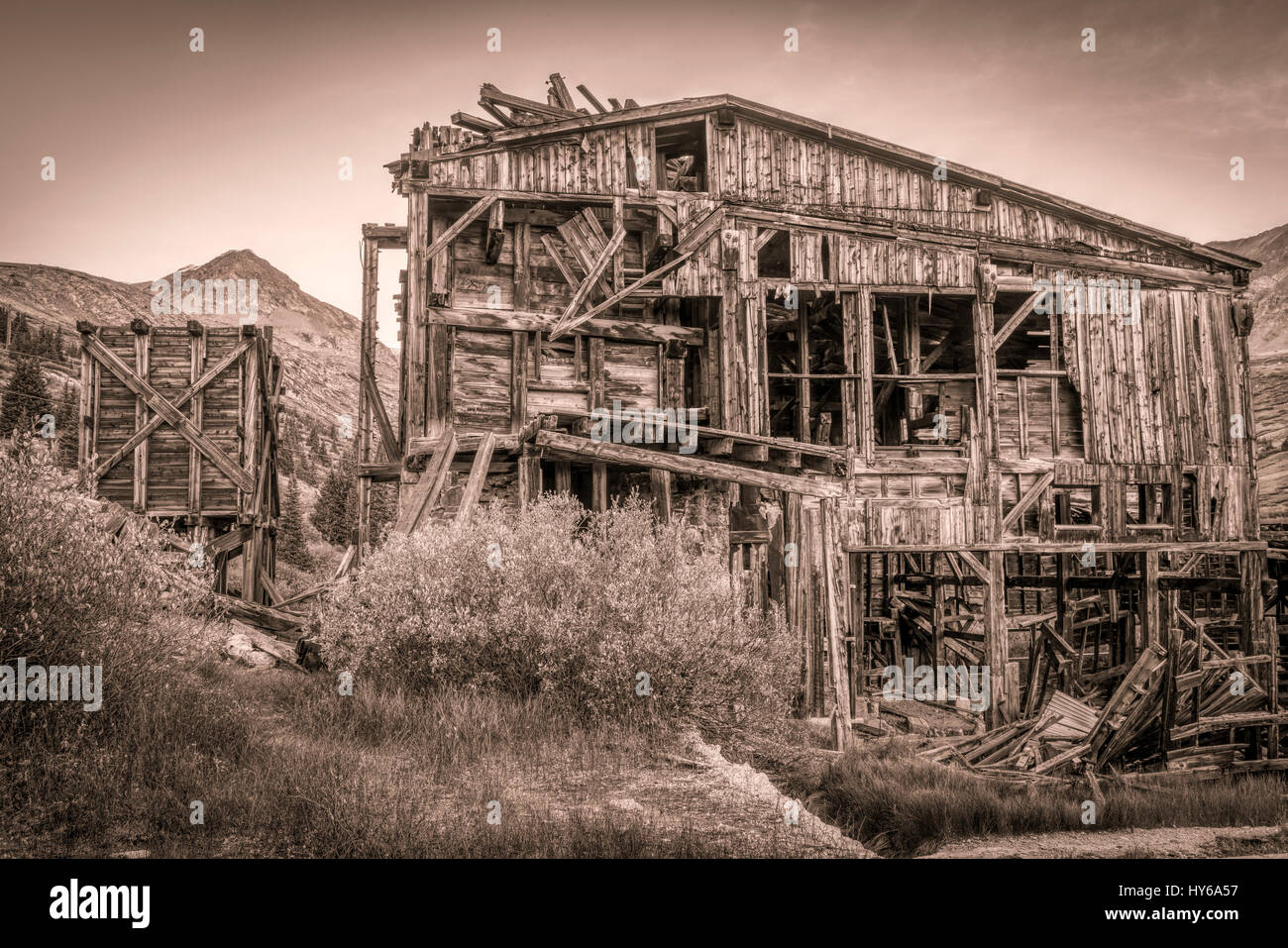 ruins of gold mine  (processing mill) near Mosquito Pass in Rocky Mountains, Colorado, sepia toning Stock Photo