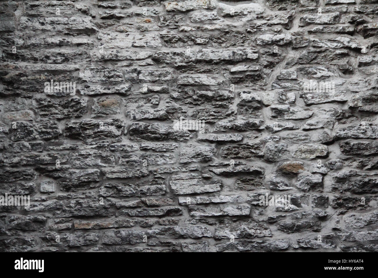 Old gray stone wall background close up Stock Photo - Alamy