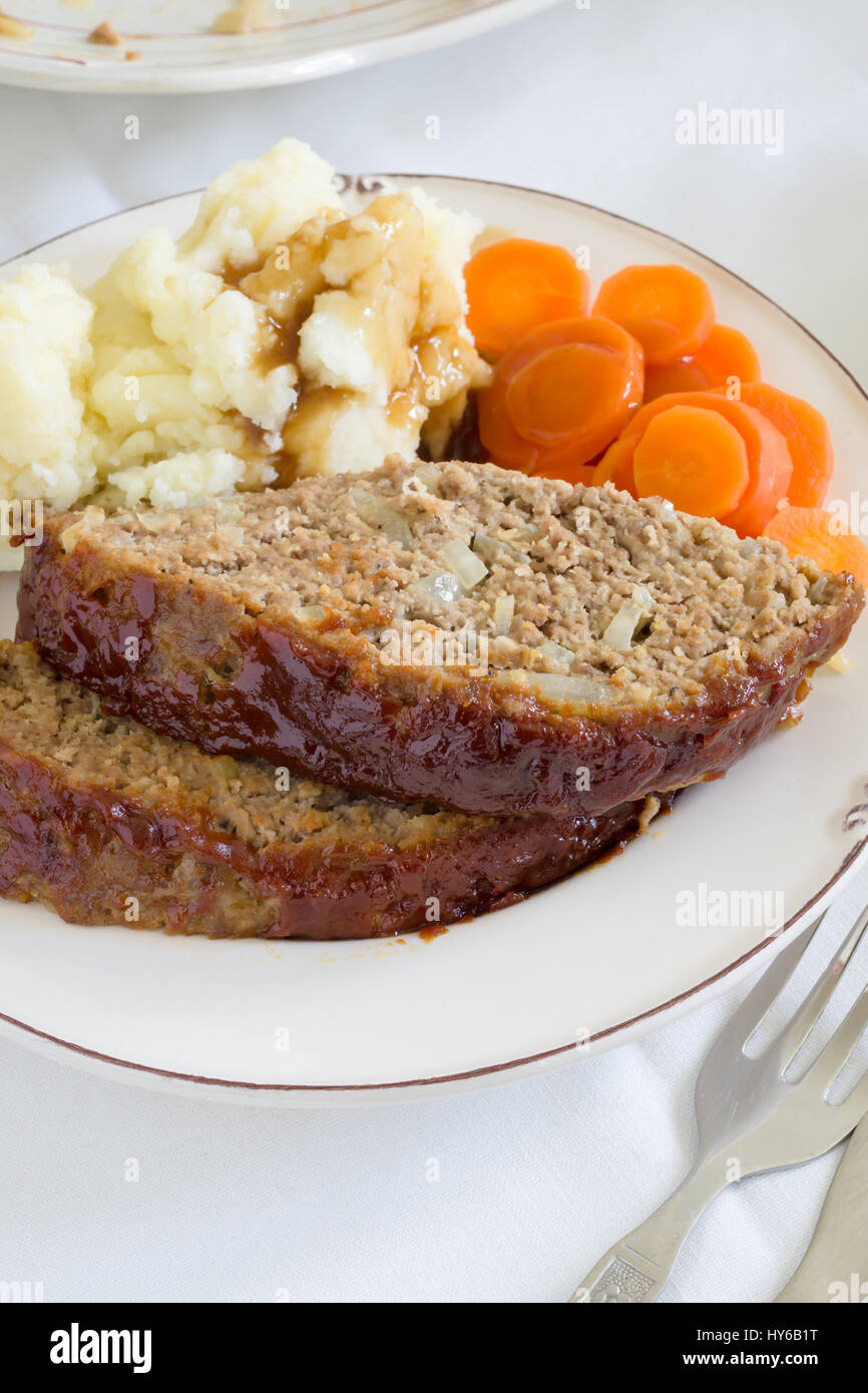 Classic American meatloaf made with ground beef oatmeal onions and a