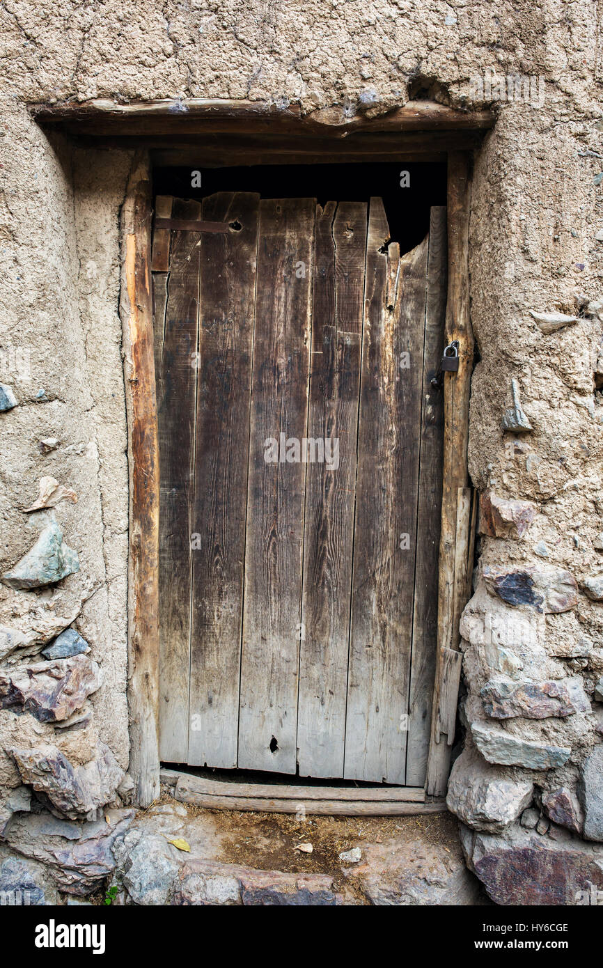 Old wooden door in stone house Stock Photo - Alamy