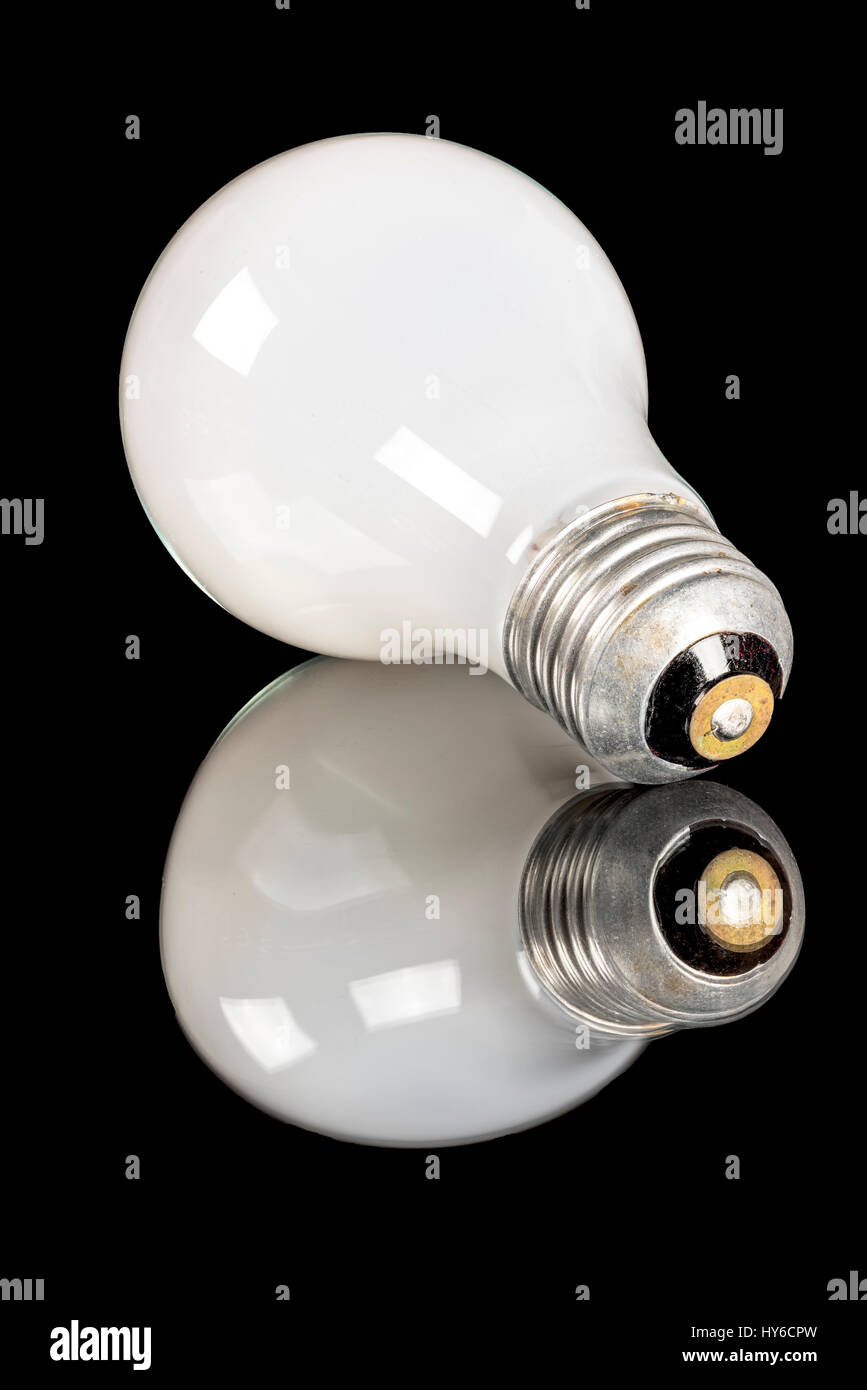 Glass electric light bulb on a reflective surface Stock Photo Alamy