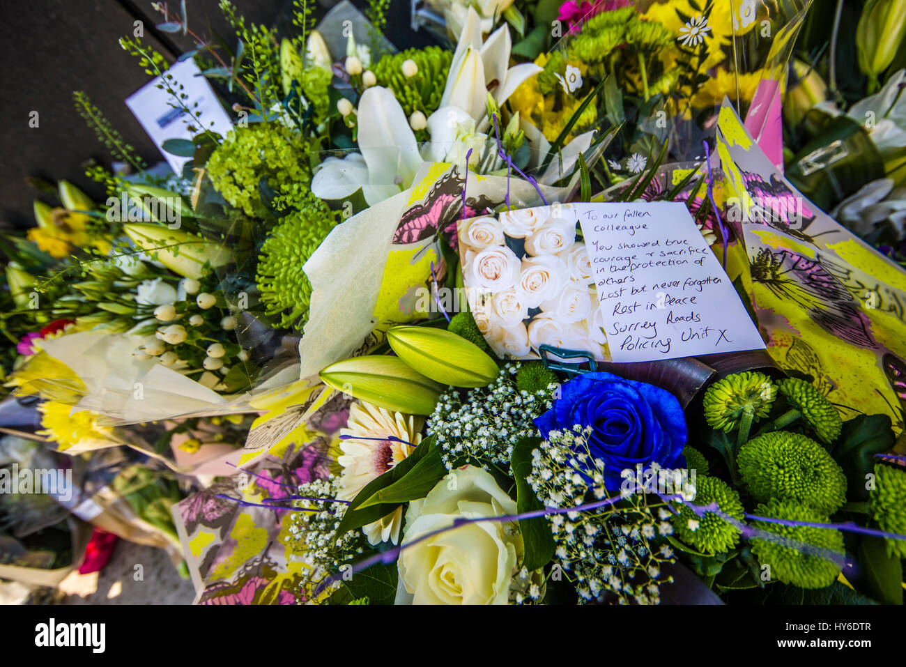 Floral tributes in honour of PC Keith Palmer placed at the National Police Memorial in The Mall London.PC Palmer was killed in Parliament by terrorism Stock Photo