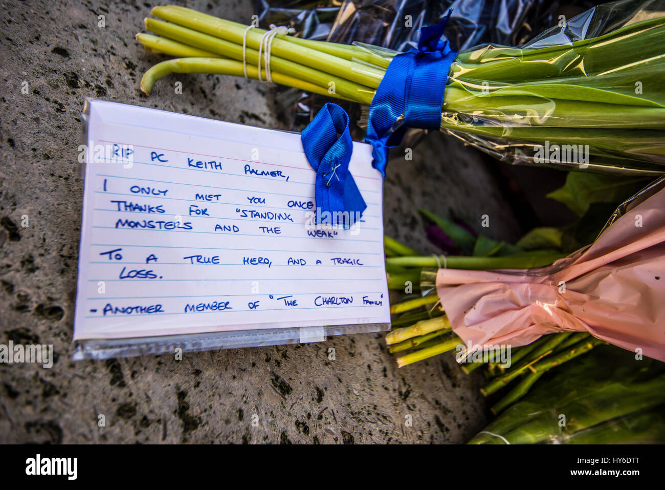 Floral tributes in honour of PC Keith Palmer placed at the National Police Memorial in The Mall London.PC Palmer was killed in Parliament by terrorism Stock Photo