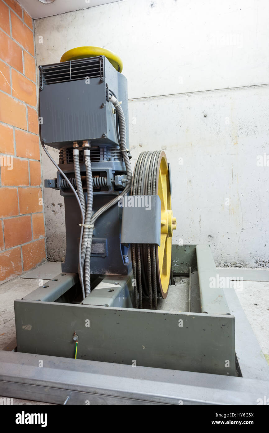 iron cables on a wheel of a motor of the elevator Stock Photo Alamy
