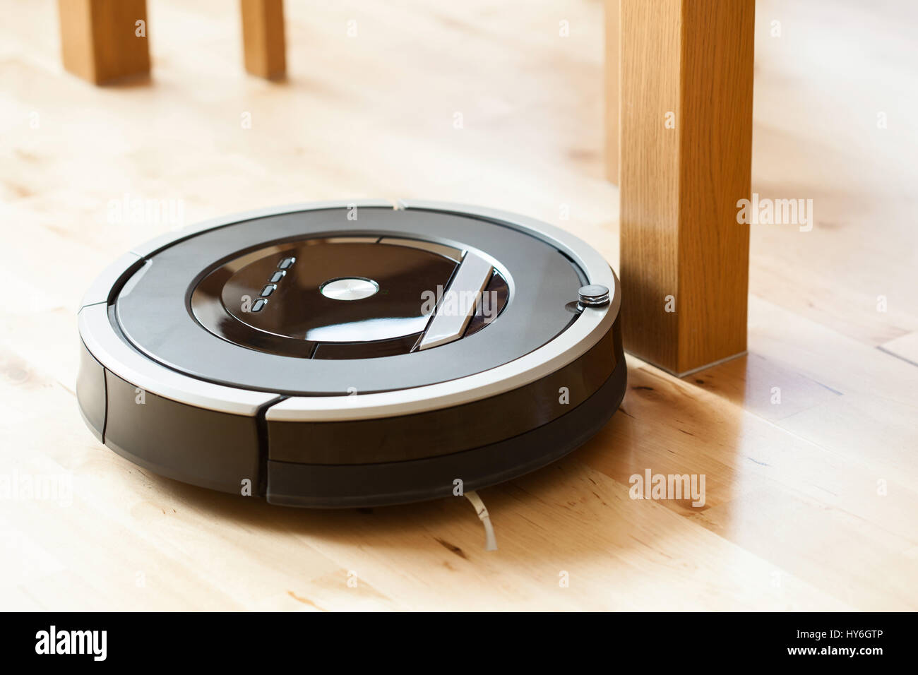 robotic vacuum cleaner on laminate wood floor smart cleaning technology