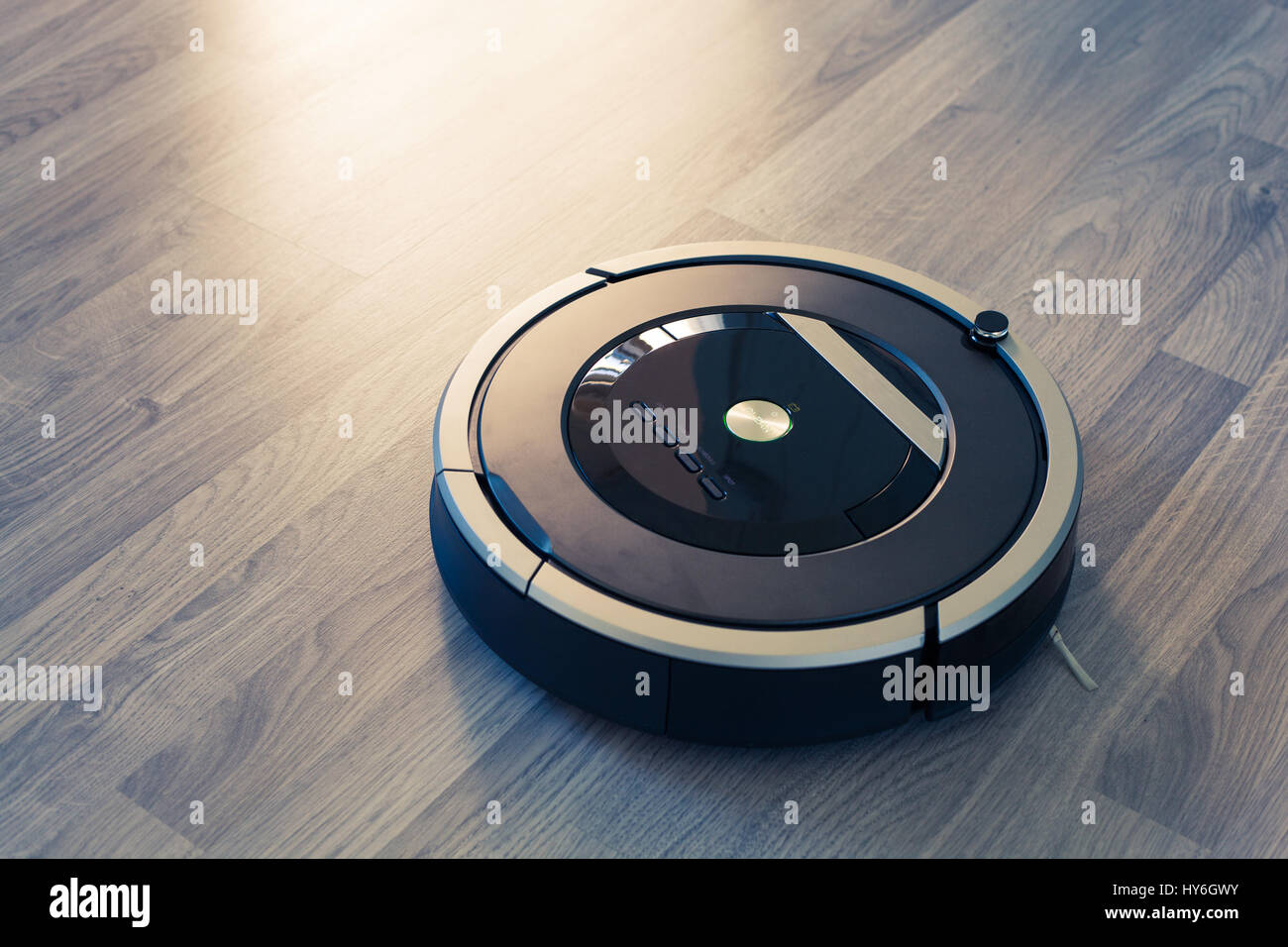 robotic vacuum cleaner on laminate wood floor smart cleaning technology