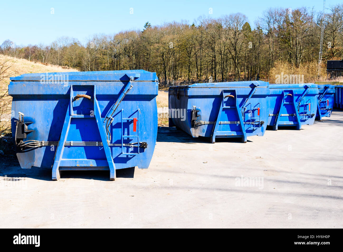 Blue container with closed hydraulic lid. Stock Photo