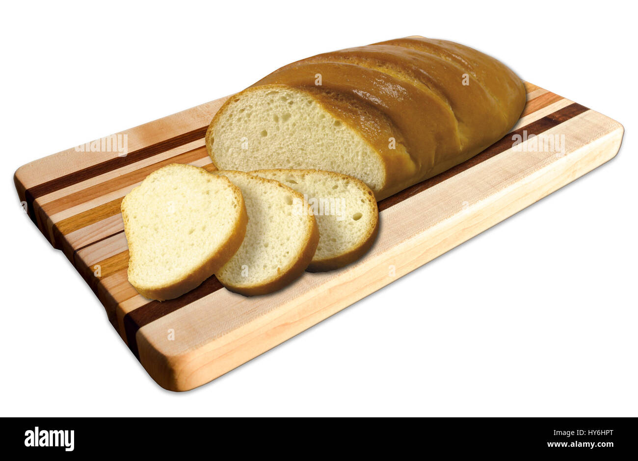 Fresh golden brown crispy baked bread sliced on a bread Board, isolated against a white background. Stock Photo