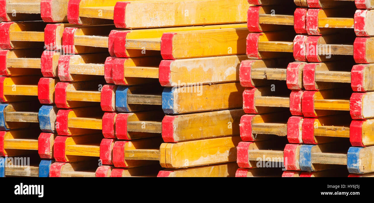 stacked up wooden bearer on a construction site Stock Photo