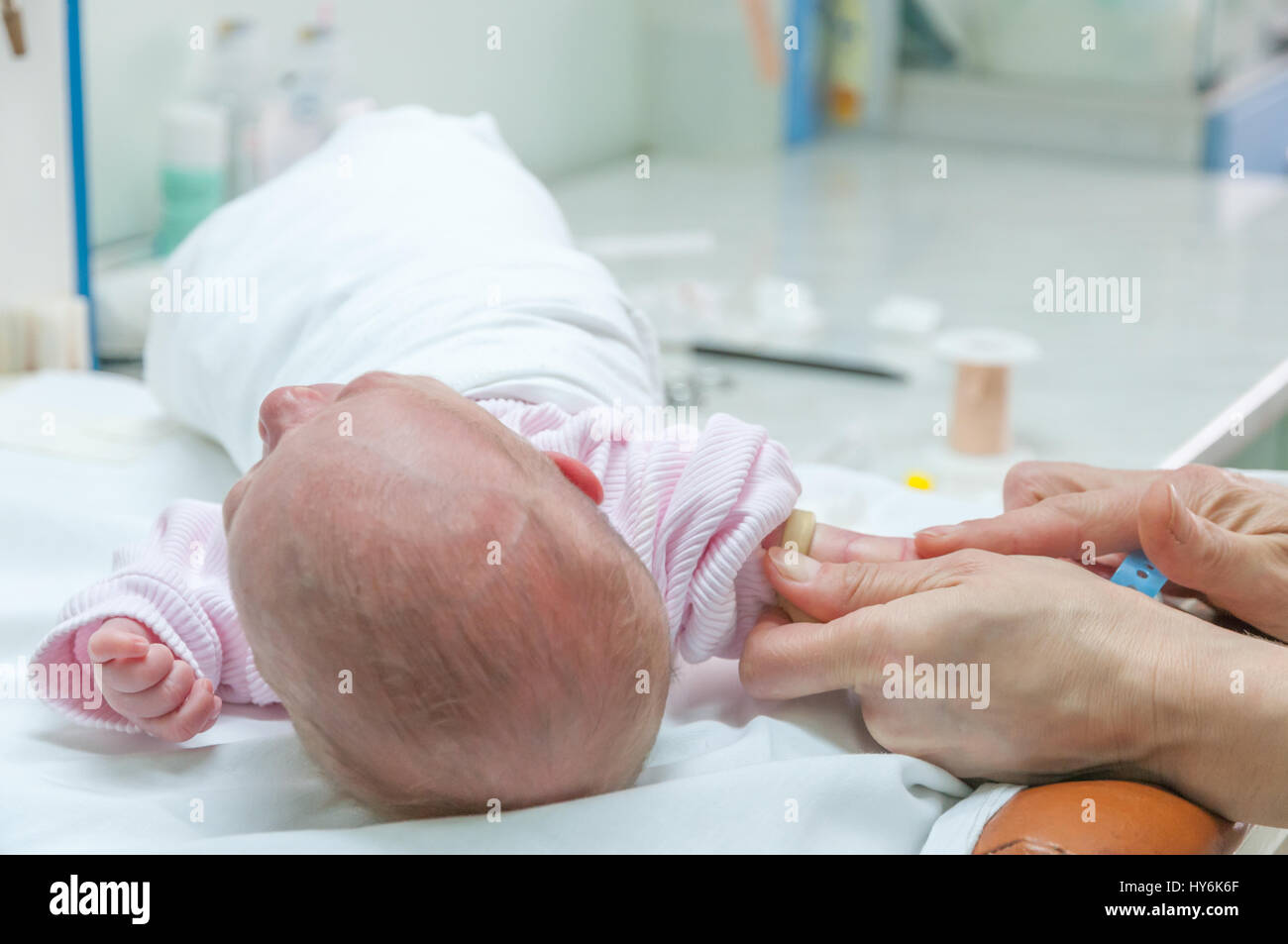 Doctor making drainage for newborn baby. Stock Photo