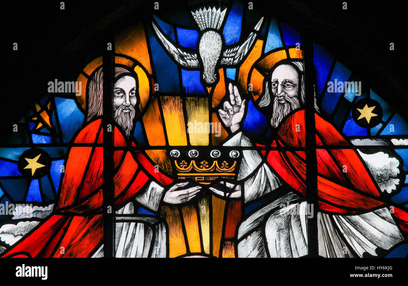Stained Glass in the Church of Tervuren, Belgium, depicting the Holy Trinity - Father, Son and Holy Spirit. Stock Photo