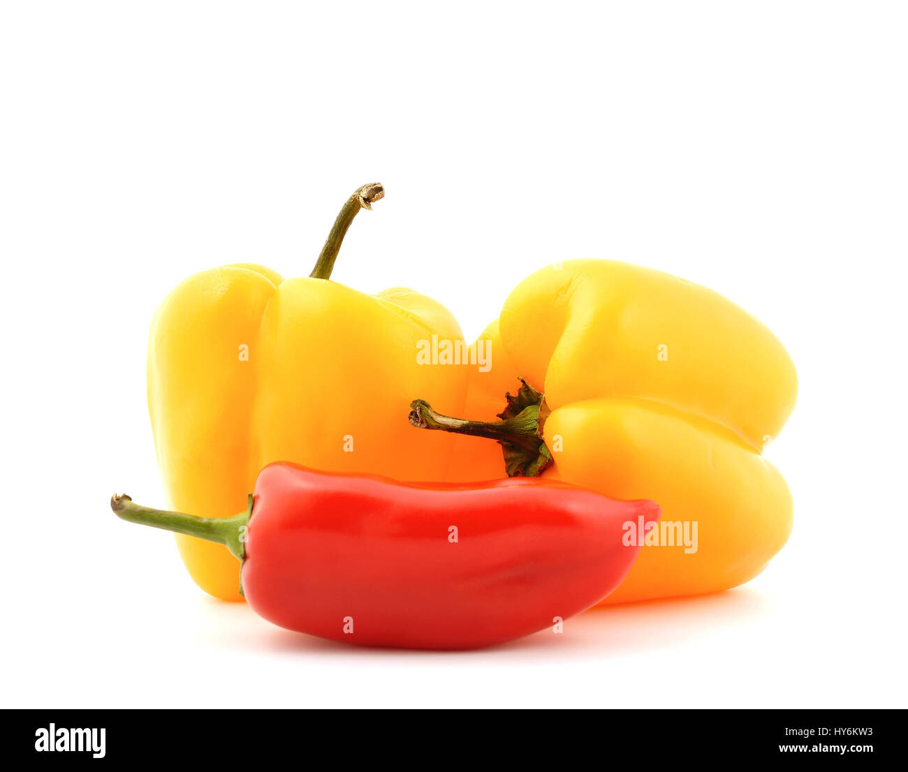 Red and yellow sweet peppers on a white background Stock Photo - Alamy