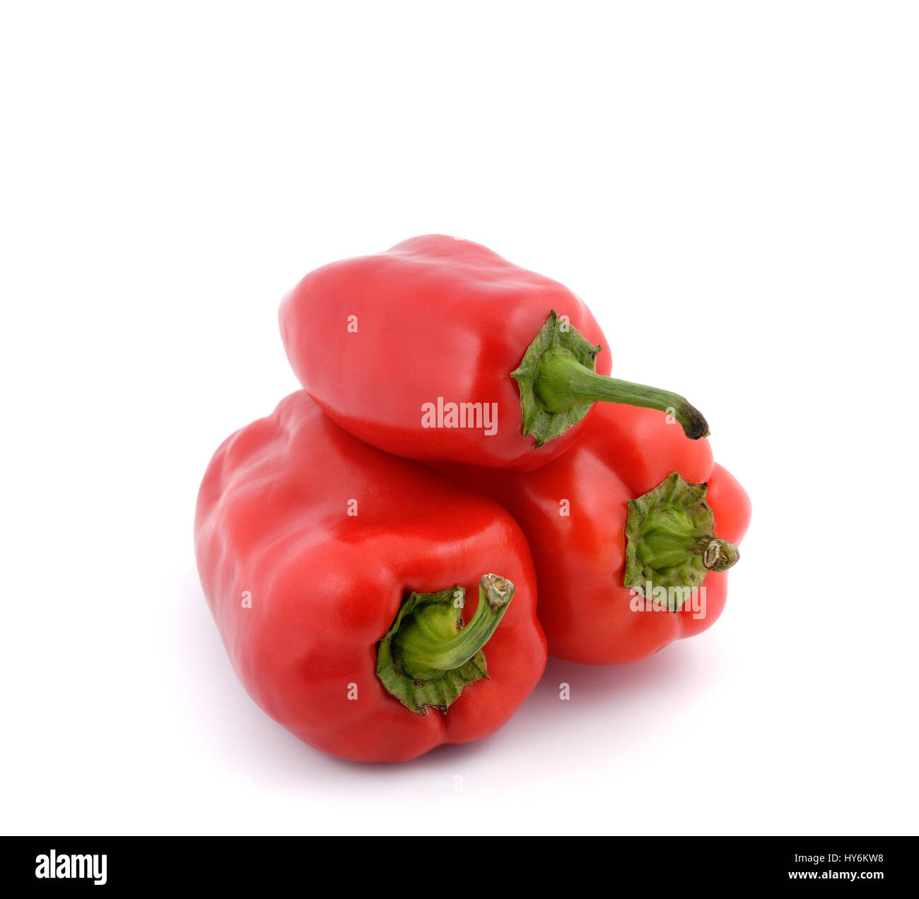 Red sweet peppers on a white background Stock Photo - Alamy