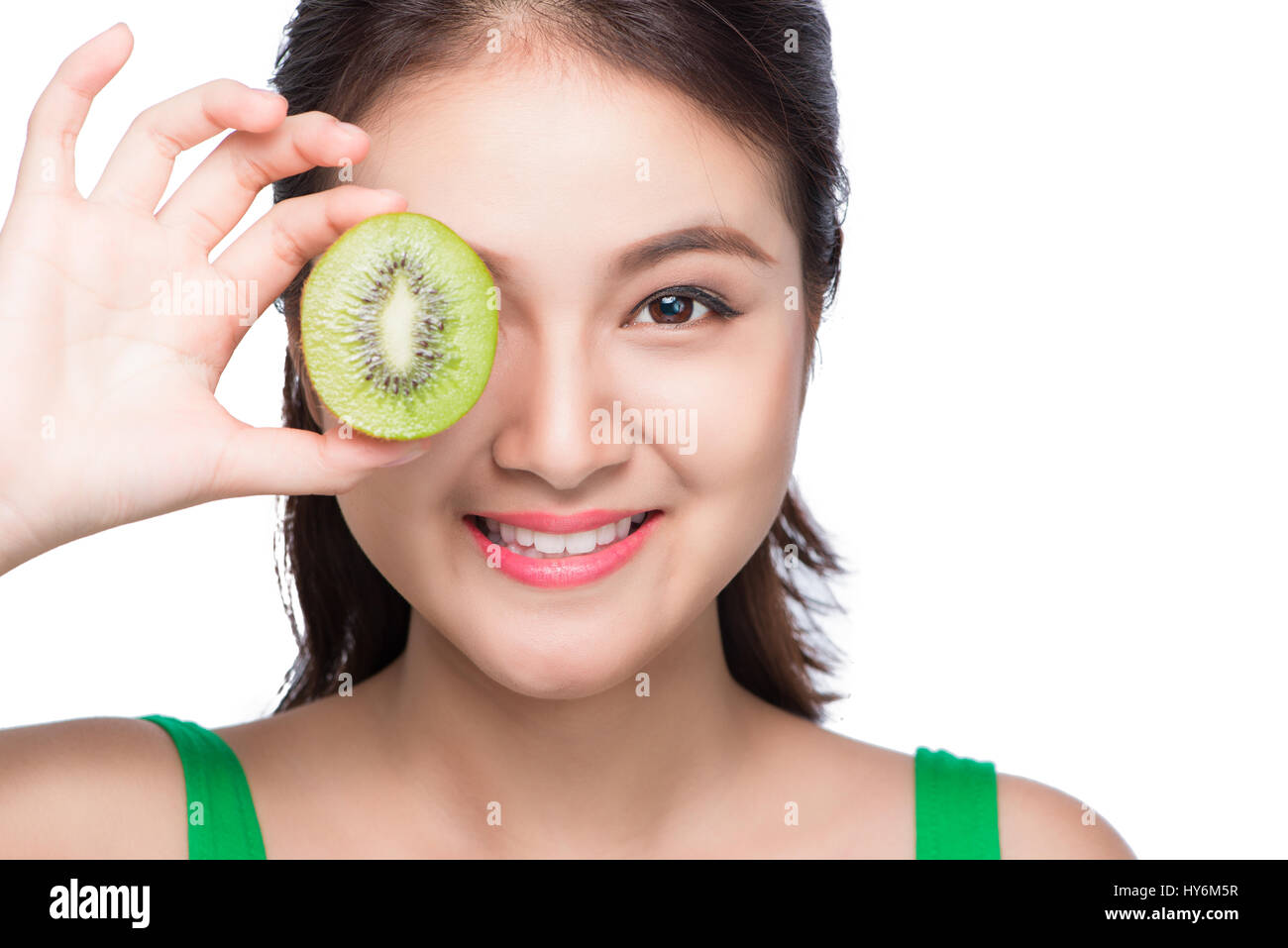 Tropical fruits. Healthy eating. Charming young asian woman holding