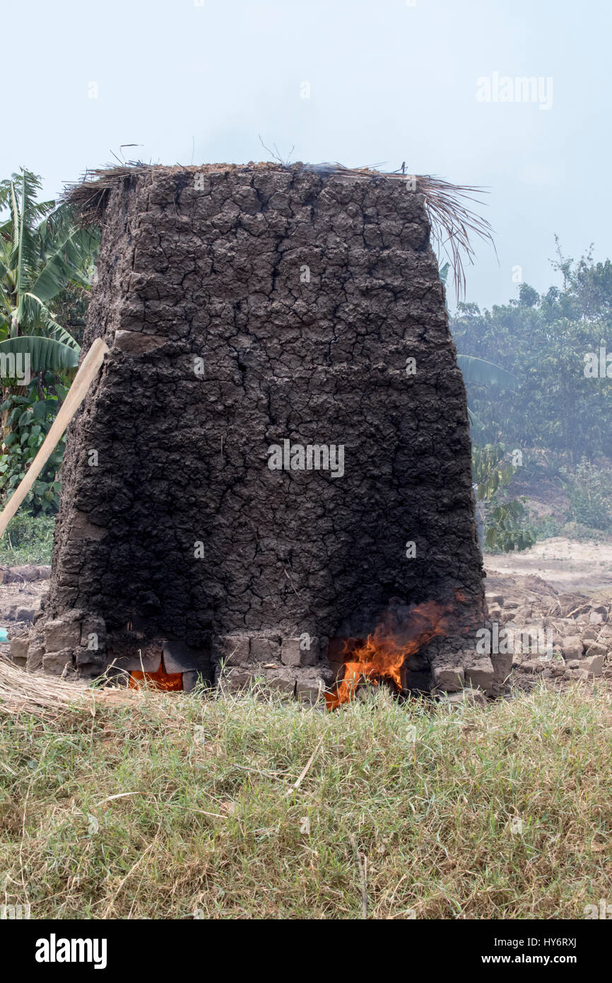 Handmade kiln used to fire harden mud bricks in rural Uganda, Africa