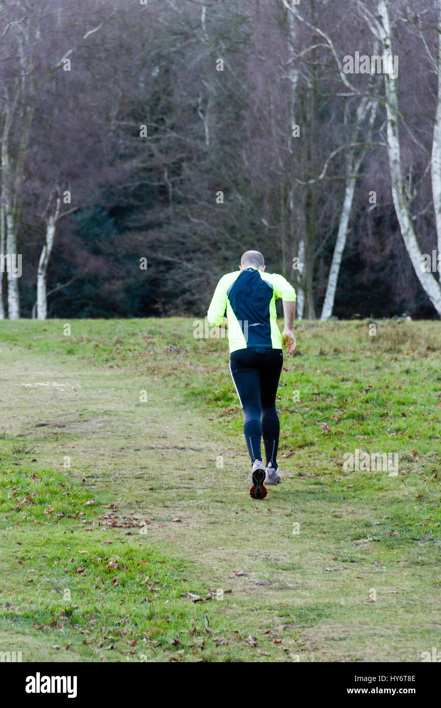 Jogger from behind in rural setting Stock Photo