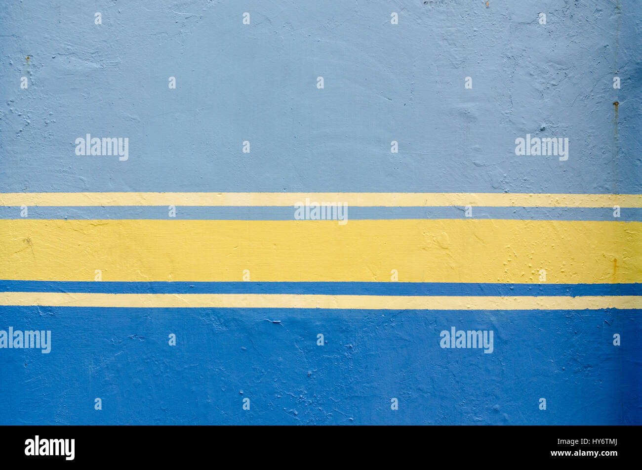 Blue painted wall and yellow line Stock Photo